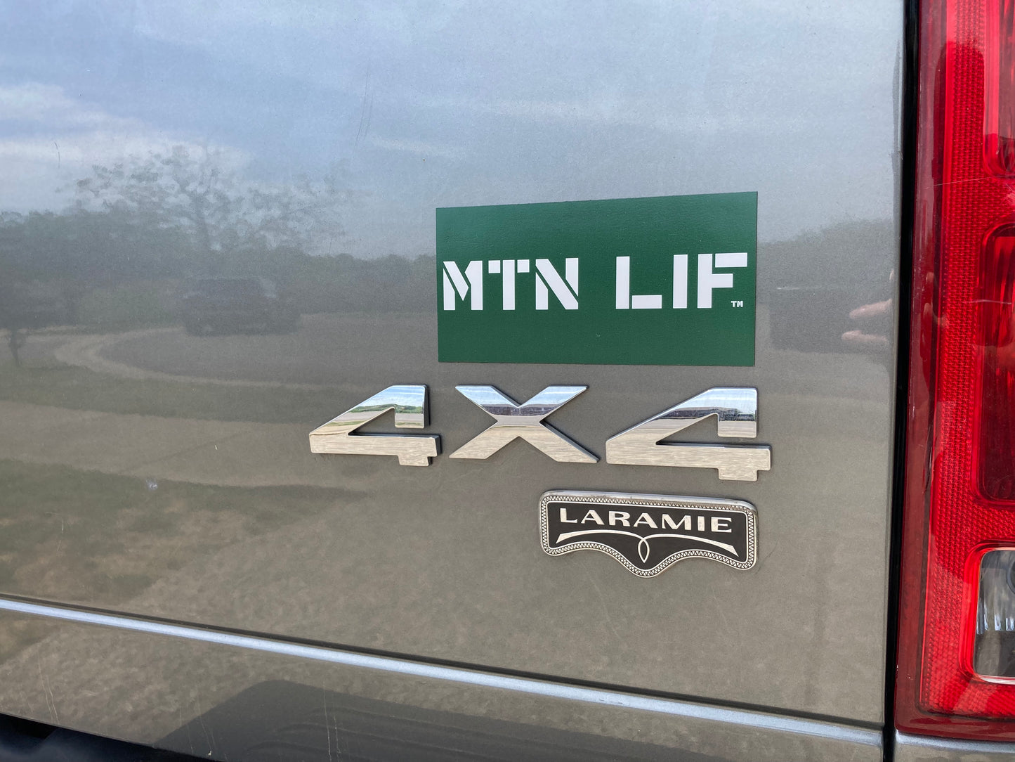 MTN LIF™ car MAGNET WHITE on dark green 3x6" Major font